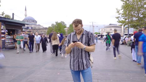 Time-lapse-of-young-man-texting-on-phone-in-Istanbul.